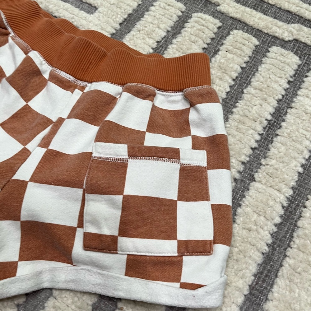 Out from under checkered shorts - Picture 11 of 11